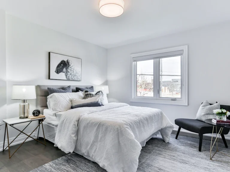 White bed and bedroom furniture prepared for protective wrapping