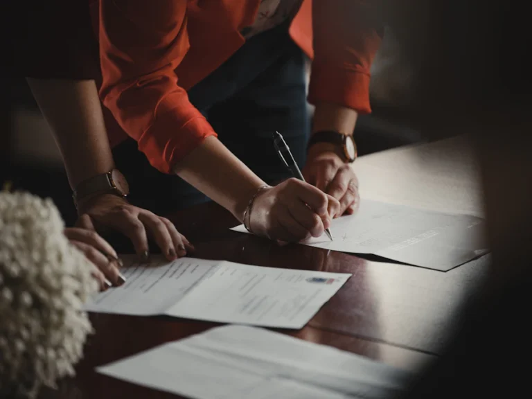 Documents being signed and organized before an office move