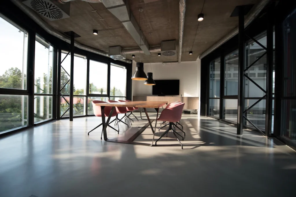 Office meeting area with table and chairs before an office relocation