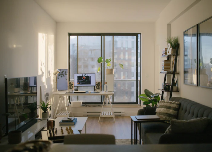 Partially furnished apartment with desk and sofa