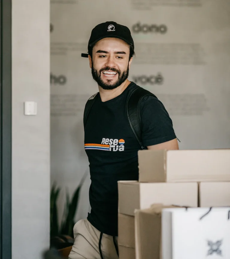 Apartment mover holding a packed box on moving day