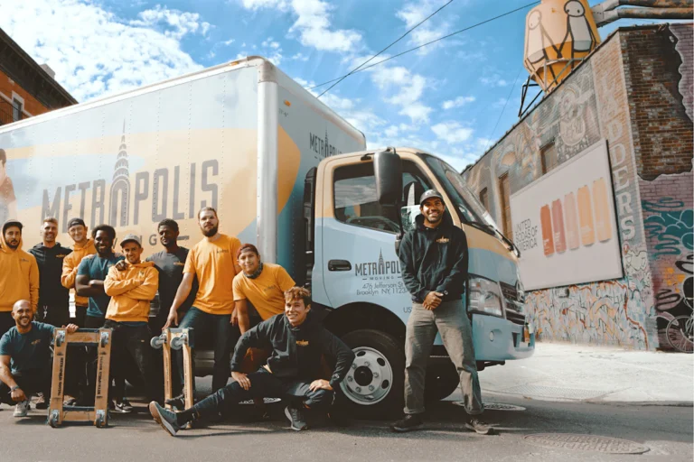 VP Furniture Movers team standing beside a moving truck